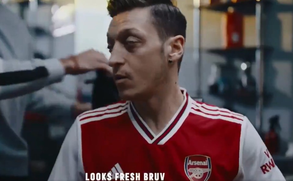 Mesut Ozil is the first player to appear in the video and donning the new Arsenal shirt