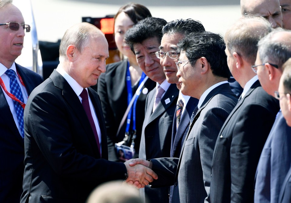 Mr Putin is greeted in Osaka by Japanese diplomats as the G20 kicks off today