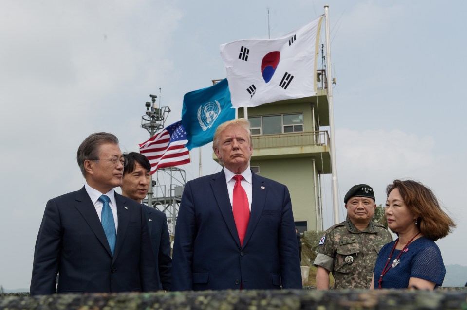  Earlier Mr Trump and South Korean President Moon Jae-in looked out over the DMZ from an outpost on the southern side