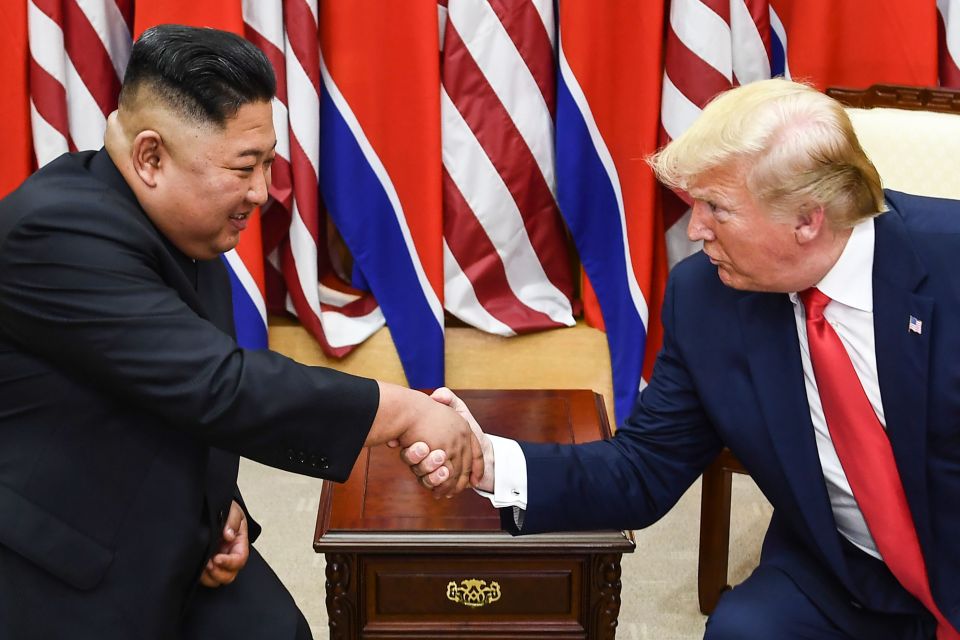  Kim and Trump shake hands during a meeting on the south side of the Military Demarcation Line that divides North and South Korea