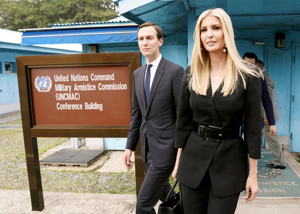  White House senior advisers Ivanka Trump and Jared Kushner walk at the demilitarised zone