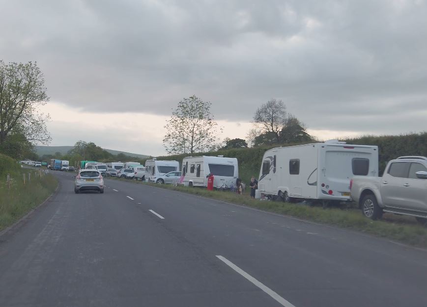  Families have set up camp with their horses on the side of the A-road with days to go til the festival