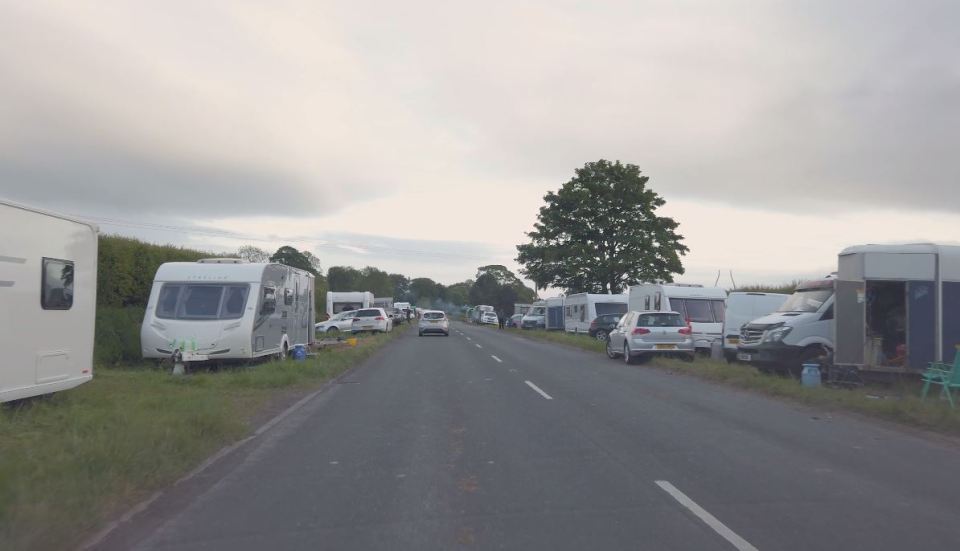  Dozens of cars and caravans line the side of the A685 ahead of the Appleby Horse Fair