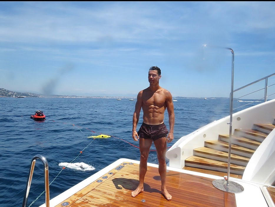 Ronaldo poses on the back of the boat as he enjoys some downtime in St Tropez