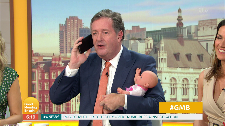  Piers demonstrated the 'manly' way to hold a child