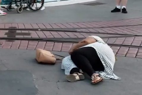  One woman was thrown on the ground after being slapped