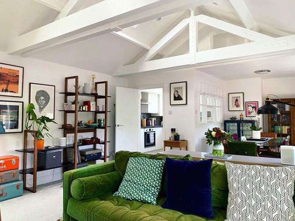  The living room featured a statement green couch