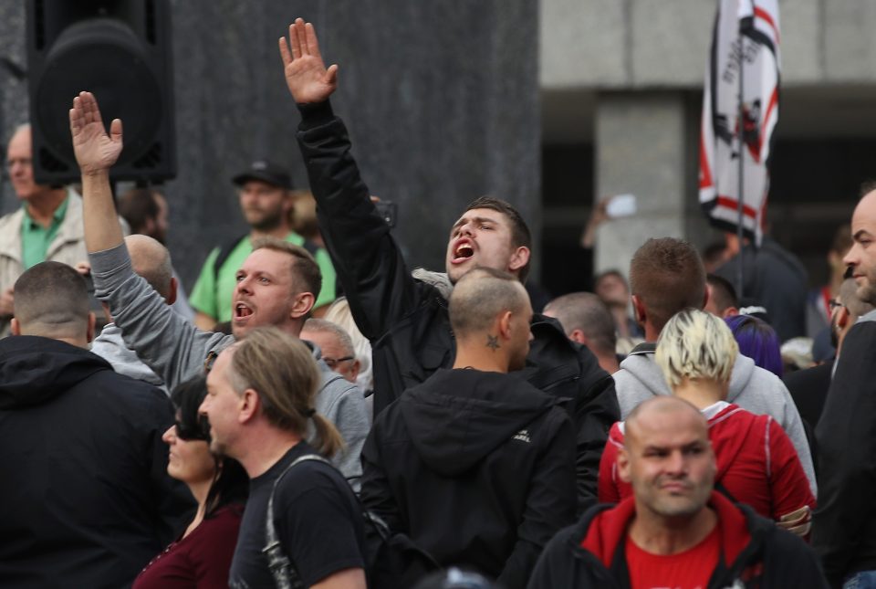  A man raises his arm in a Heil Hitler salute in Chemnitz, Germany