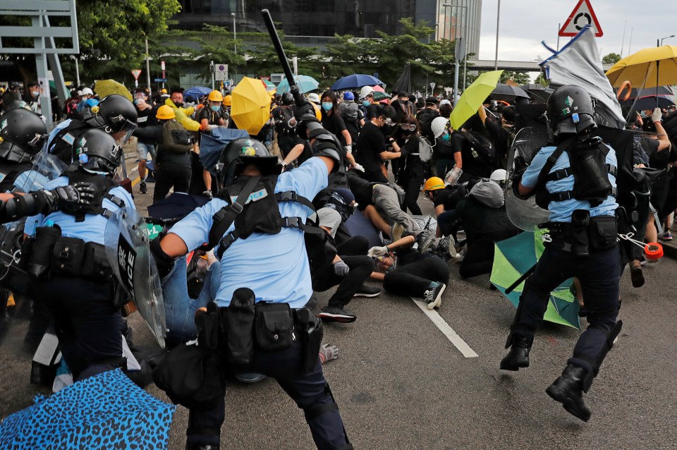  Police beat back protesters during a demonstration last month