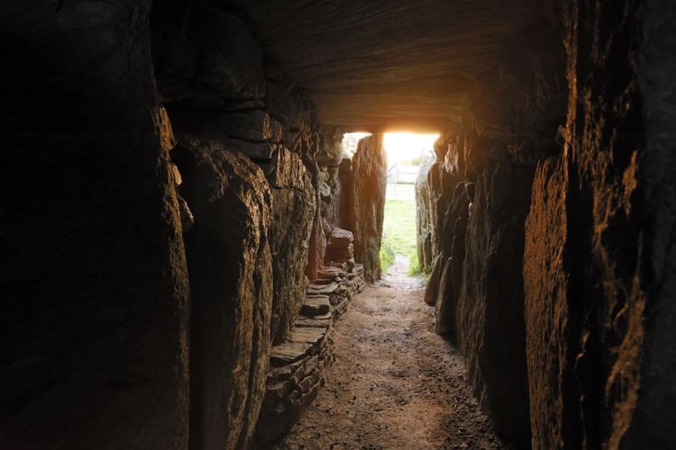  On the longest day of the year the sun rays light up the entire passage inside Bryn Celli Ddu