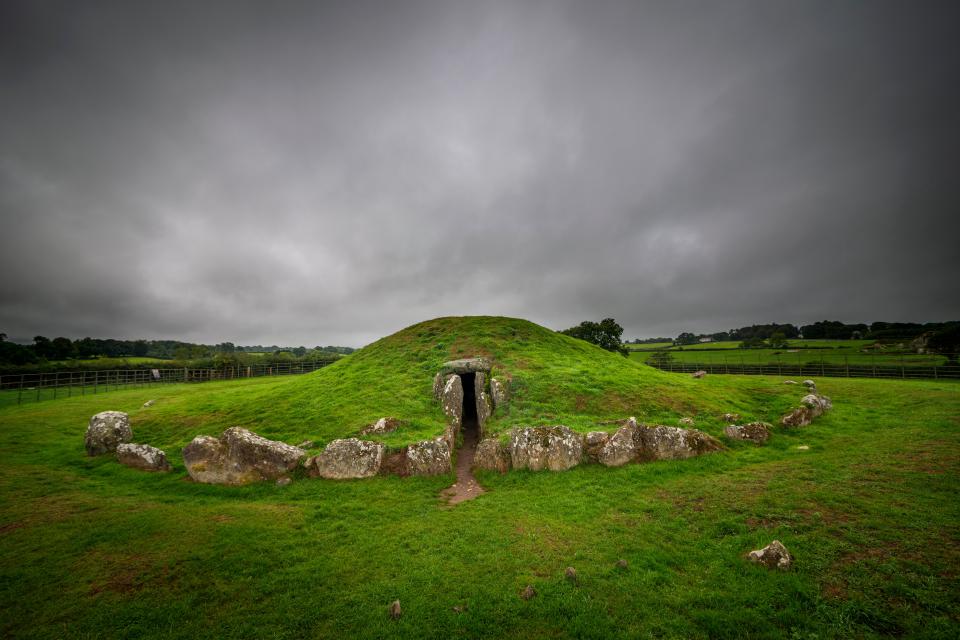  The burial site is located just to the side of this ancient passage tomb