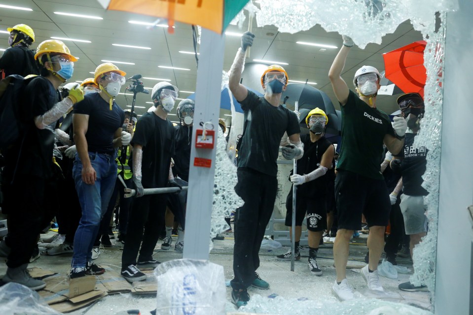  Protesters break the windows of the Legislative Council building in Hong Kong