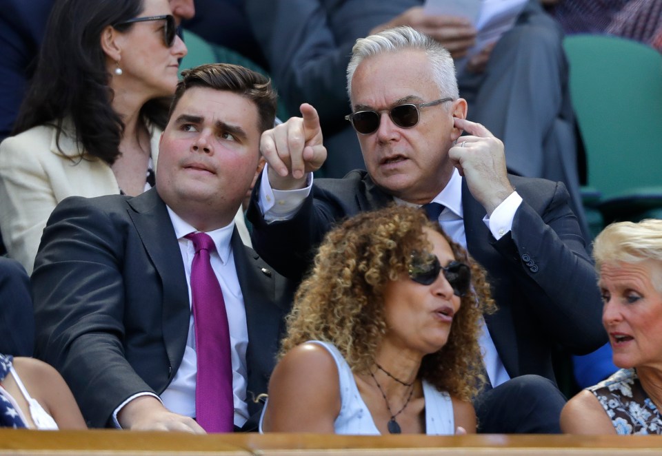 Huw Edwards (R) with his son Daniel Edwards attend day 4 of the Wimbledon Tennis Championships