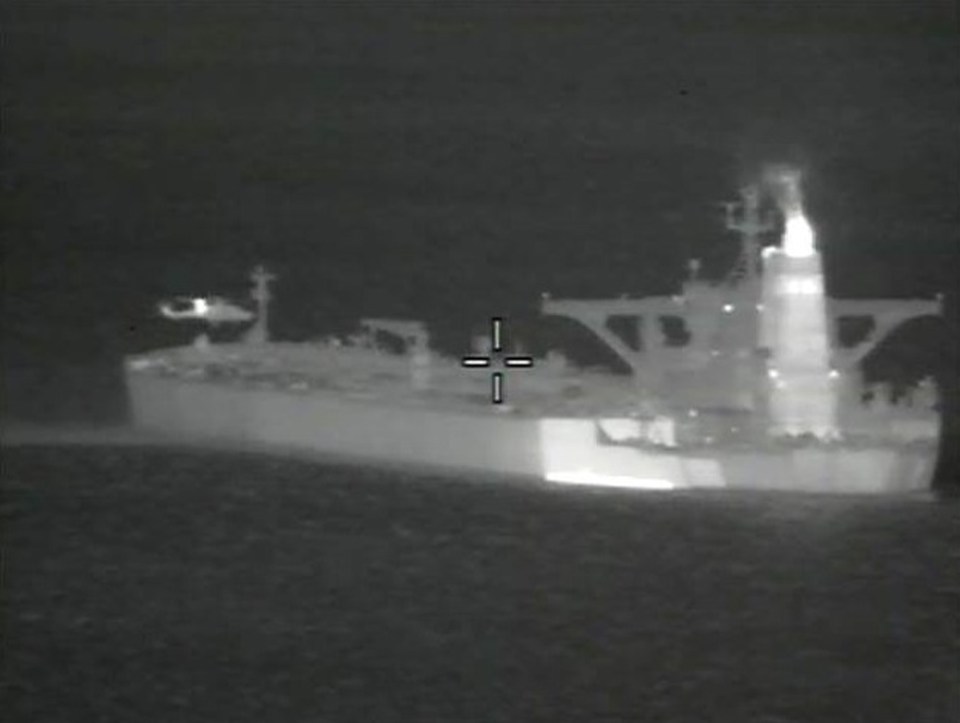  An infra-red camera catches the moment Royal Marines abseil down from the Wildcat helicopter onto Iranian tanker Grace 1