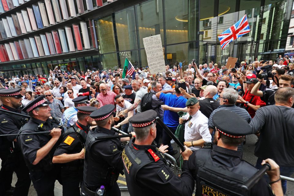  A metal barrier separated police from fuming Robinson supporters