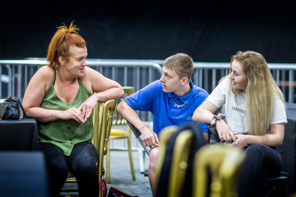  A fighter's family wait ring side as he's weighed