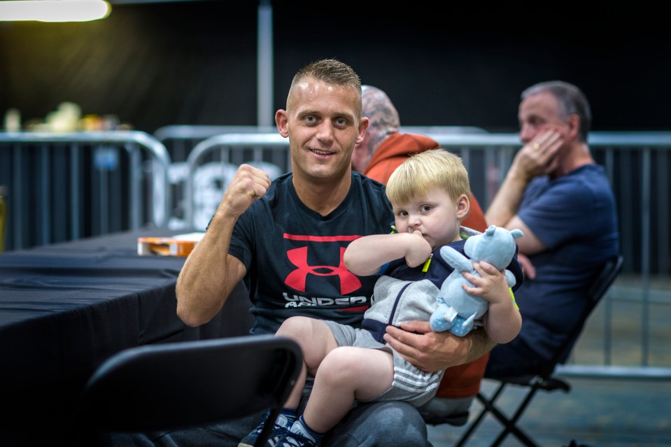  A fighter with his young son ahead of his match