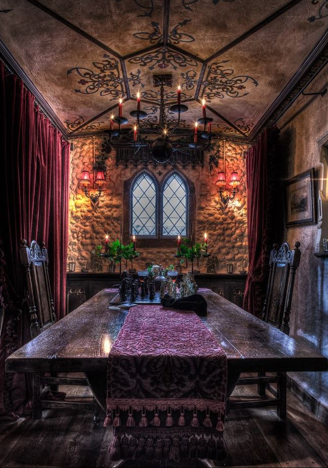  The three-bedroom property features a Victorian dining room, with an ornate purple table runner