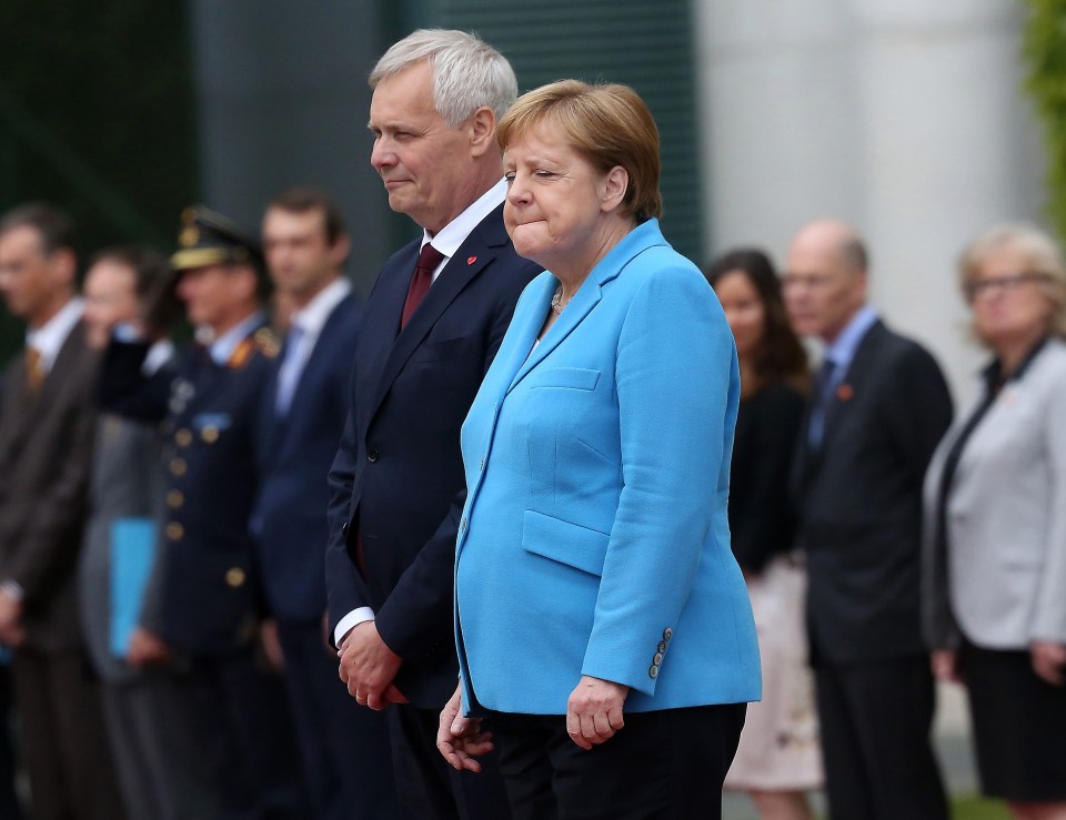 Angela Merkel was seen shaking as she greeted the Finnish PM in Berlin today