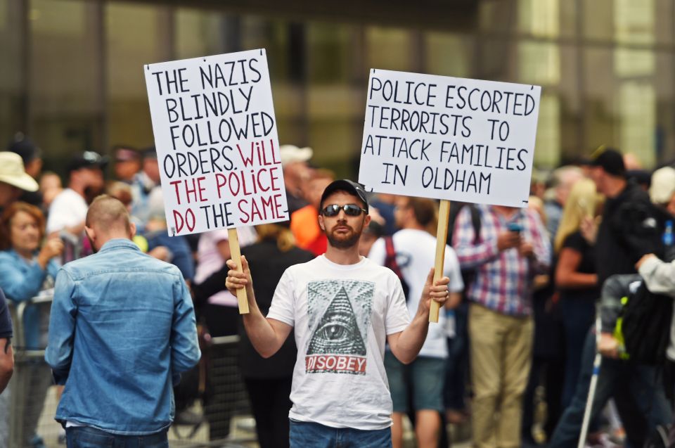  Supporters waved signs as they waited outside the court for Robinson's sentencing