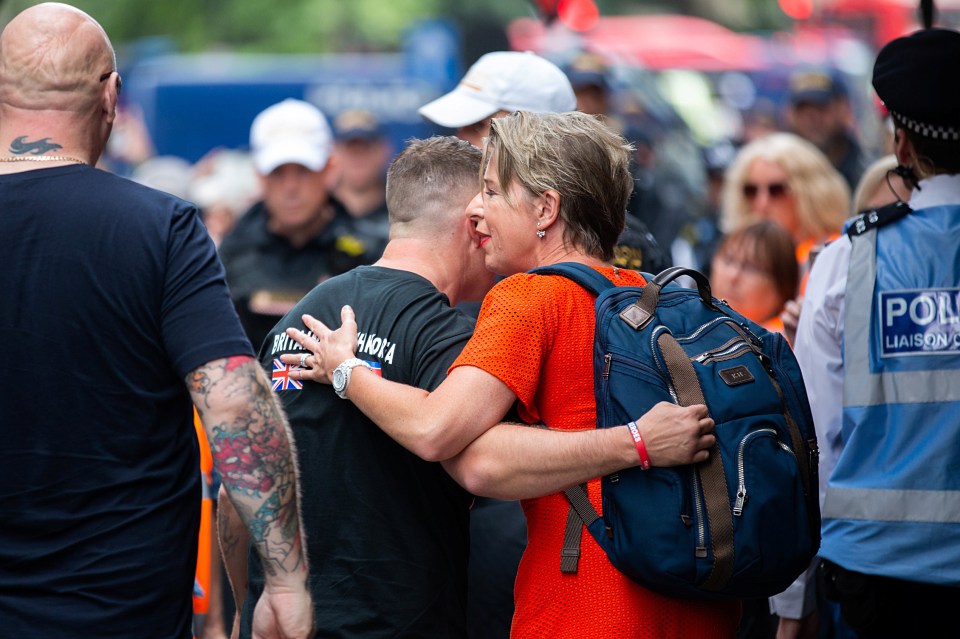  Katie Hopkins hugs Tommy Robinson as he arrives in court