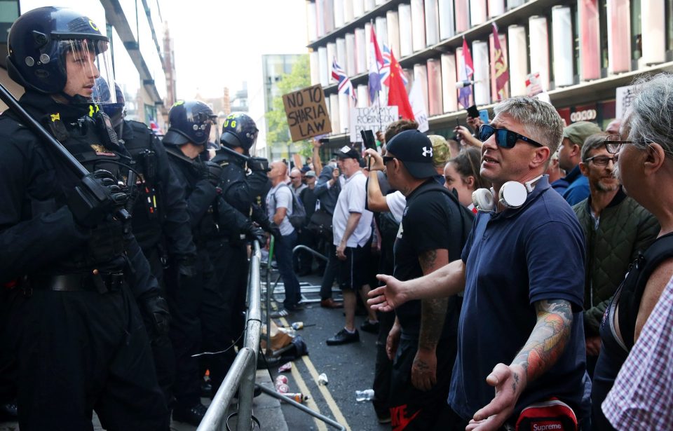  Tommy Robinson fans confronted armoured cops after the sentencing