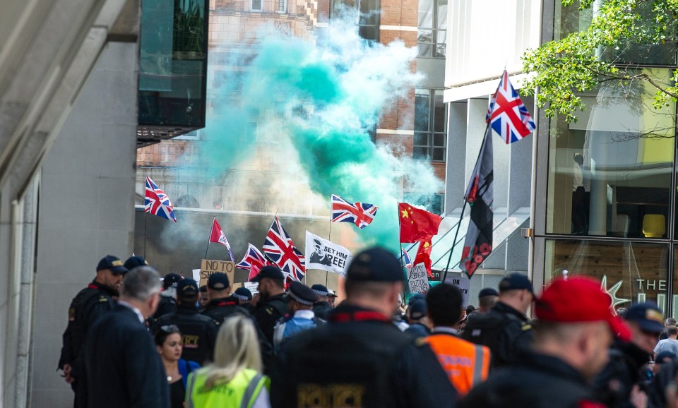  Smoke was seen billowing in the streets as protesters marched through London