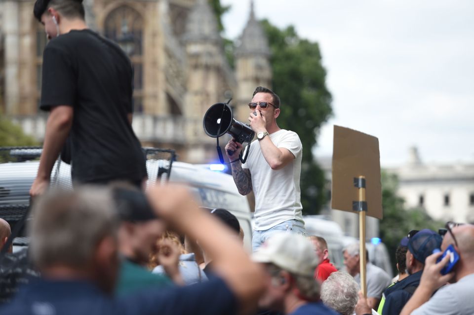  Danny Tommo addresses Tommy Robinson supporters outside the Houses of Parliament