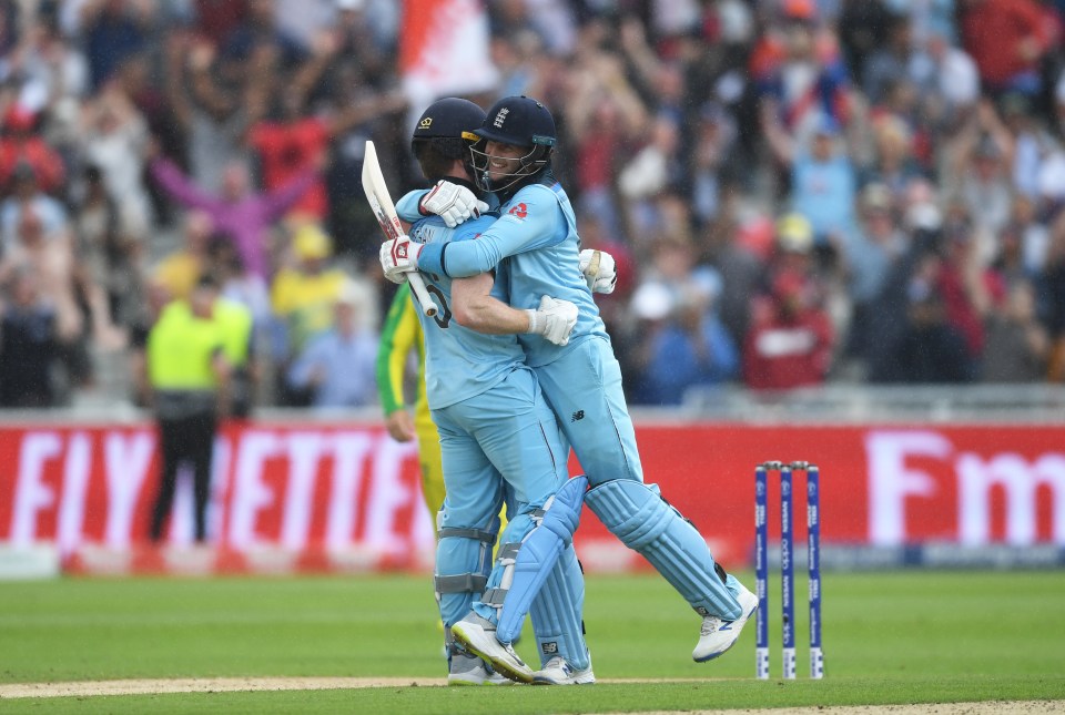  Eoin Morgan and Joe Root embrace after leading England to the final