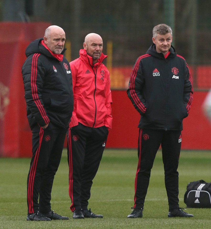  Mike Phelan (left) stands with Mark Dempsey and manager Ole Gunnar Solskjaer