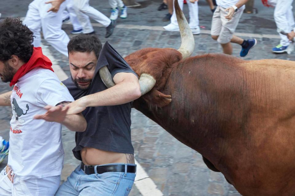  One runner narrowly avoids getting a horn through his face