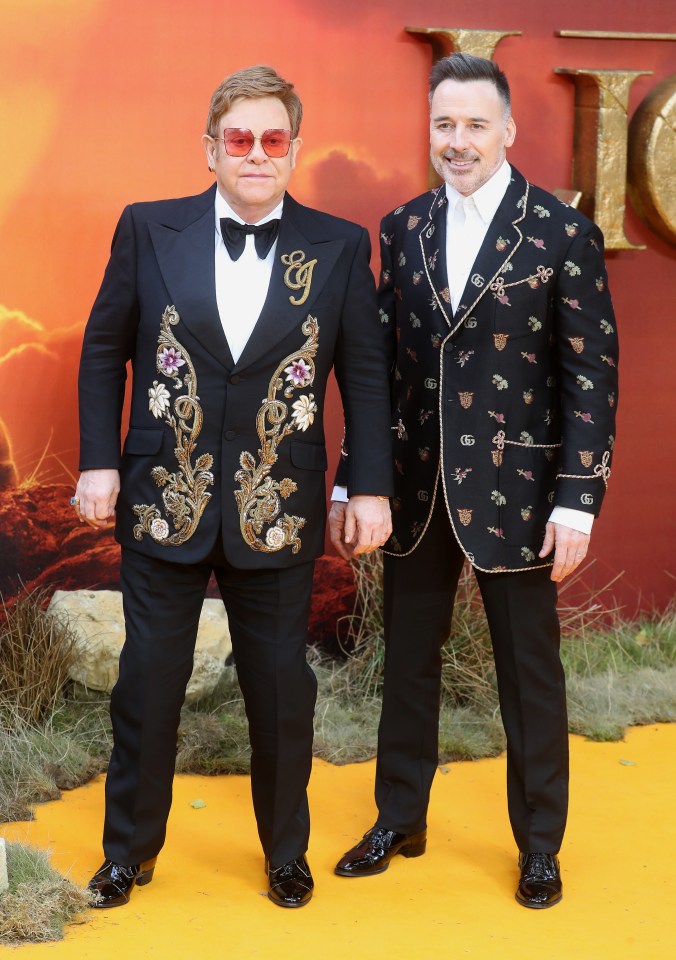  Elton John and David Furnish attending the Lion King premiere