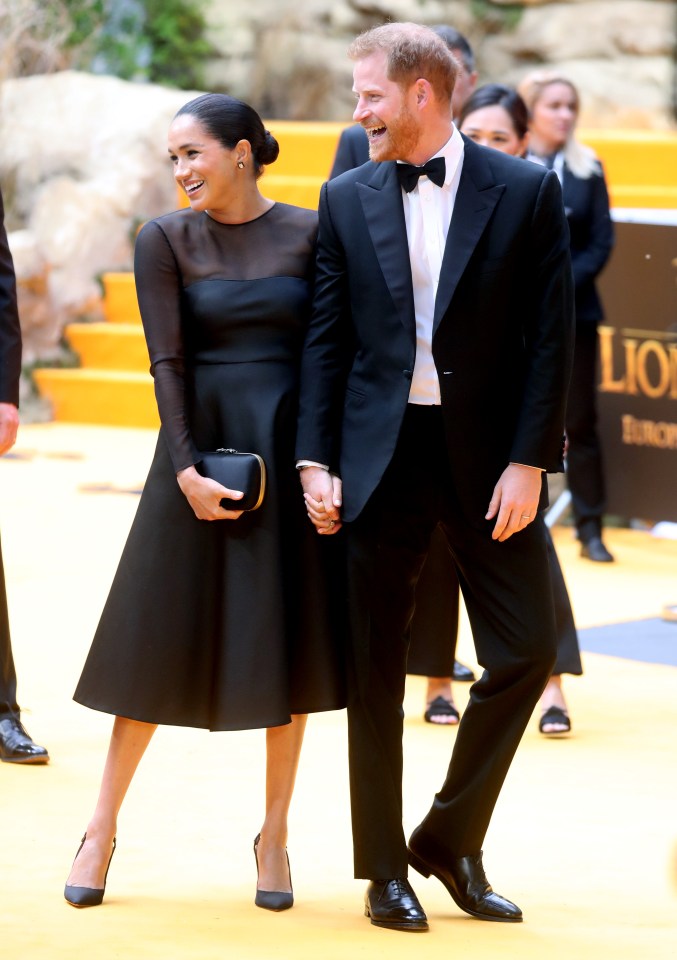  The royal couple share a laugh as they head in to the premiere of the updated Disney classic