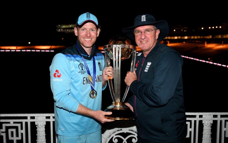  England skipper Eoin Morgan celebrates the win with Trevor Bayliss