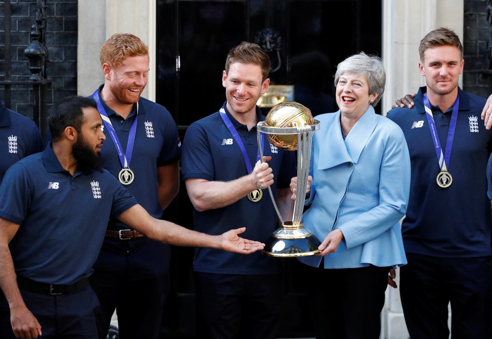  Mrs May seemed overjoyed as she held the cup with the jubilant squad