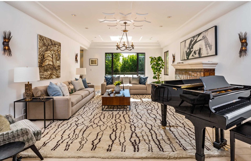 One of the living rooms boasts a grand piano