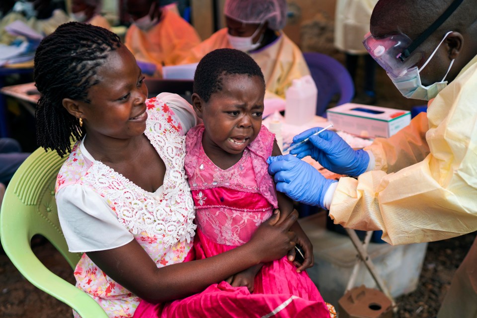  A girl receives the Ebola vaccine at a treatment centre in Beni, Congo