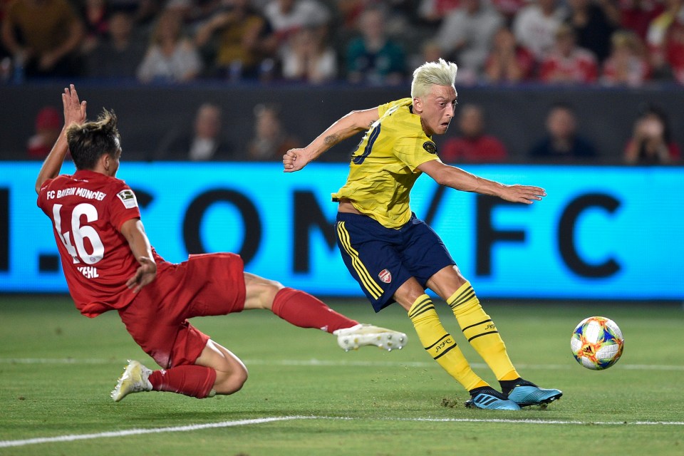  Mesut Ozil, with his new bleach blonde hair, impressed against Bayern