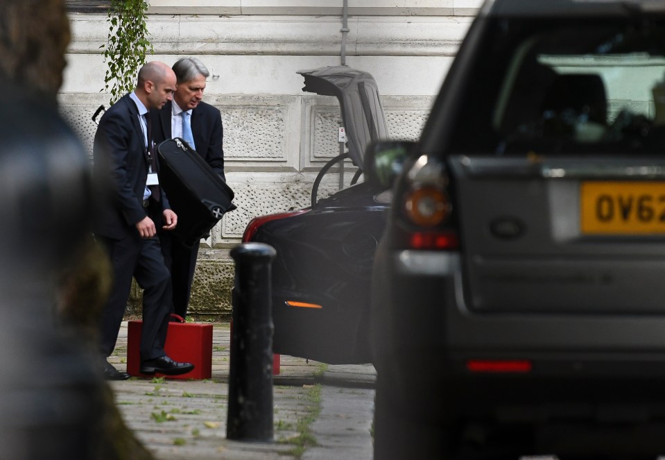  The Chancellor was seen loading bags into a car yesterday