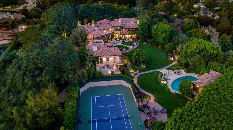 The stunning property comes complete with pool and tennis court