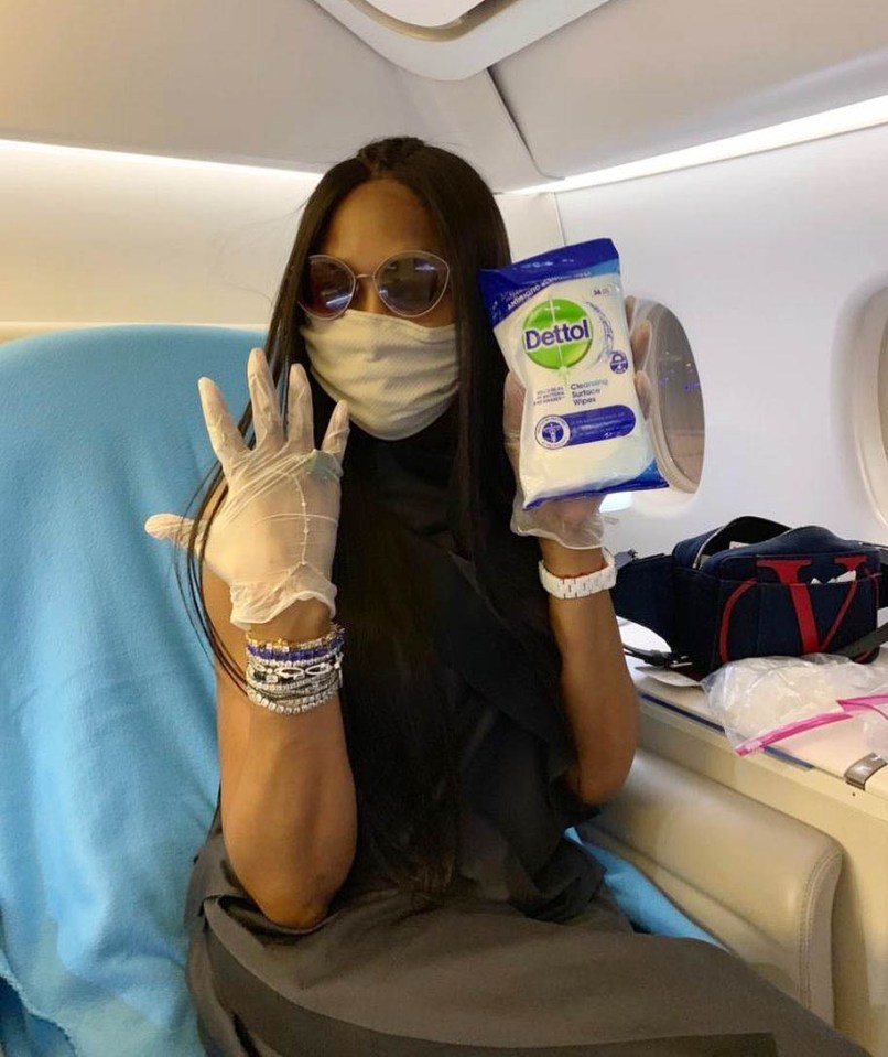  Naomi Campbell makes sure to fly safe by disinfecting her seat and wearing a face mask