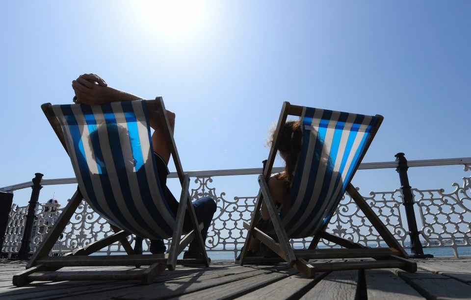  A couple enjoy the sunshine on Brighton Palace Pier