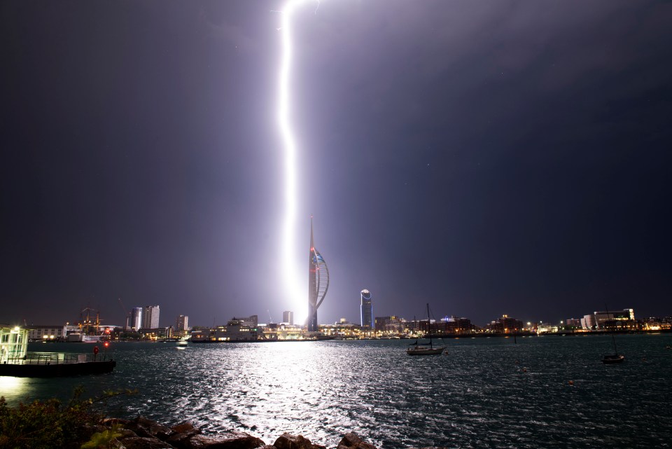  A bolt of lightning strikes the ground near the Spinnaker Tower in Portsmouth, Hampshire