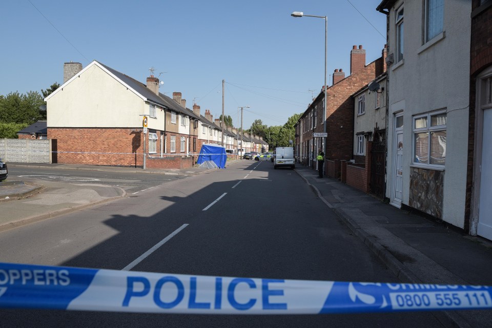  Police erect an evidence tent and cordon off the area