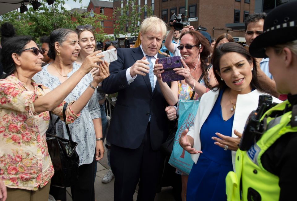  Mr Johnson was mobbed by shoppers when walking around Birmingham with Home Secretary Priti Patel