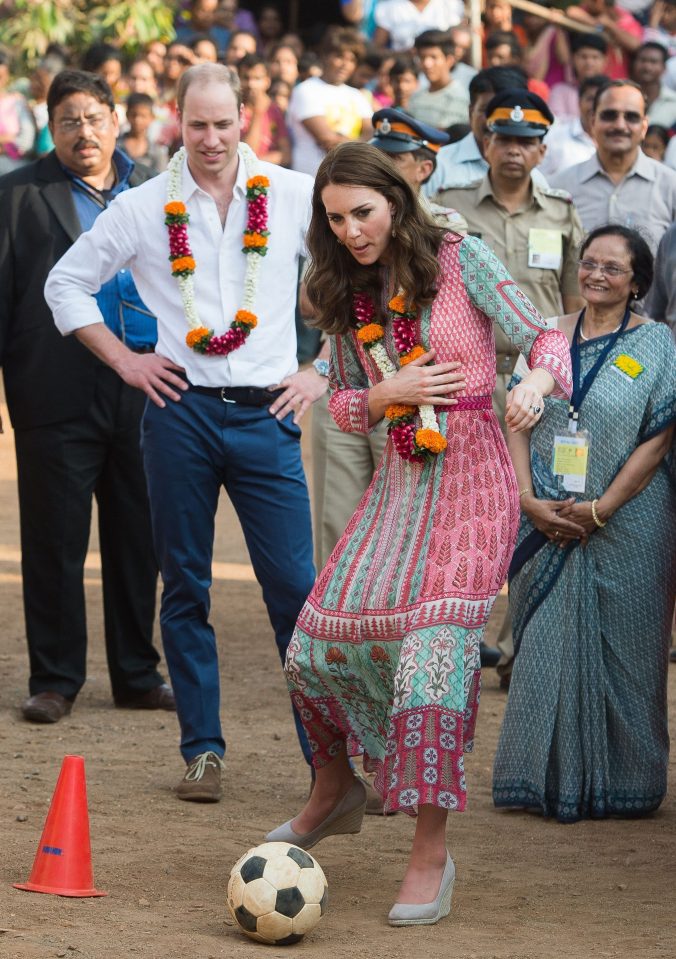  The competitive pair play football during a visit to Mumbai, India