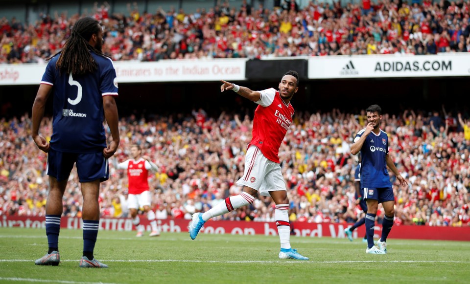  Arsenal striker Aubameyang celebrates his instinctive effort against Lyon