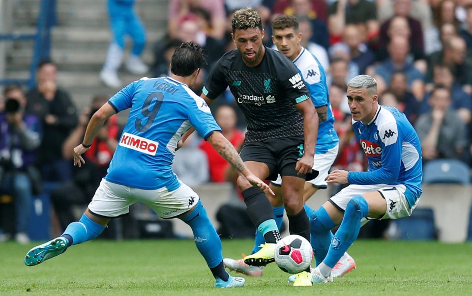  Alex Oxlade-Chamberlain evades Napoli's Simone Verdi as the Liverpool midfielder enjoys a full pre-season after injury problems