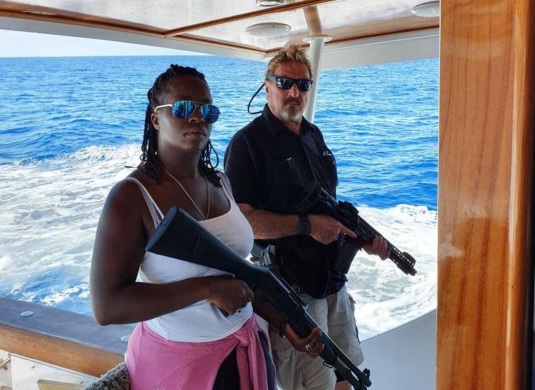 Gun-toting John McAfee wields a rifle on a yacht days before his 2019 arrest