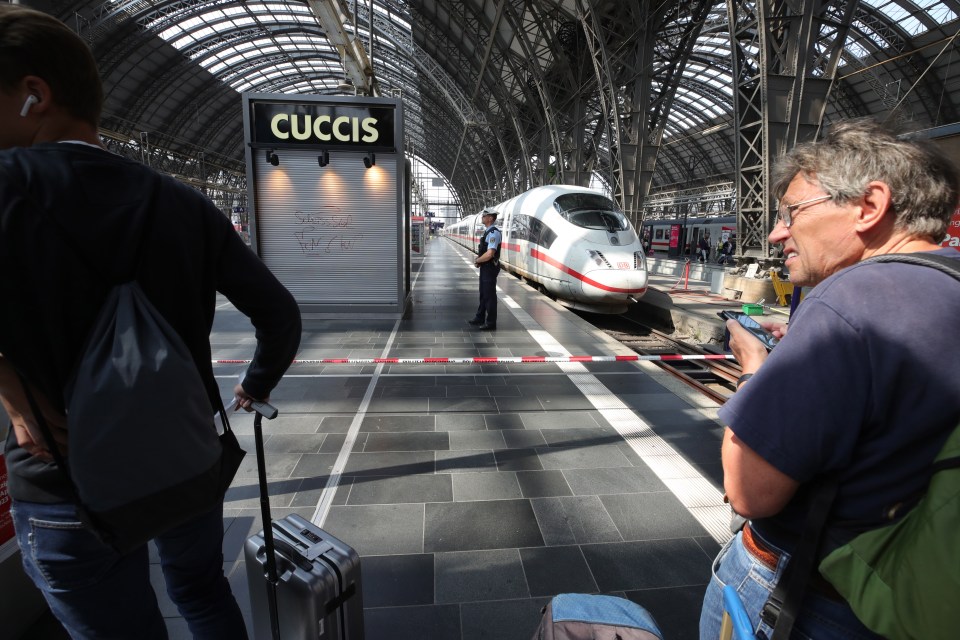  Cops cordon off areas near the platforms at the main train station in Frankfurt